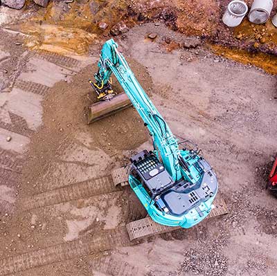 Kaivuutyöt — kaivinkone työssä